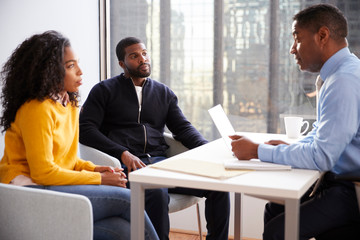 Wall Mural - Couple Meeting With Male Financial Advisor Relationship Counsellor In Office