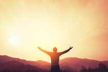 Copy Space Of Man Rise Hand Up On Top Of Mountain And Sunset Sky Abstract Background.