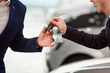 Keys to the car in the hands of the seller and the buyer of the 