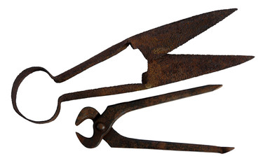 Old pincers  and scissors on white