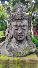 Poster - Buddha image in the tropical garden in Bali