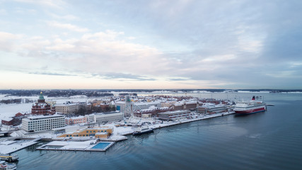 Wall Mural - Ariel panoramic view of Helsinki at winter with a Cathedral church and Katajanokka area on the shore of Baltic Sea. Finland