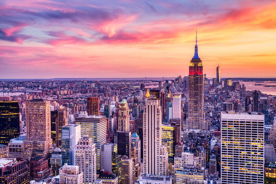 new york city midtown with empire state building at amazing sunset