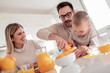 © ivanko80 - Family make fresh orange juice