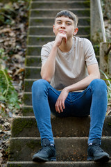 Teenage boy outside on a bright Spring day