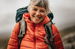 © Jacob Lund - Portrait of a smiling woman on a hiking trip