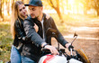 © klepach - young couple on motorcycle laugh
