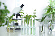 © New Africa - Glass tubes with plants in rack on table against blurred background. Biological chemistry
