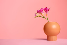 Stylish Vase With Beautiful Flower On Table Against Color Background, Space For Text