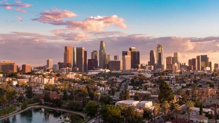 Wall Mural - Aerial time lapse in motion or hyperlapse over Echo Park of downtown Los Angeles, California skyline and skyscrapers from above on a sunny day during golden hour before sunset.