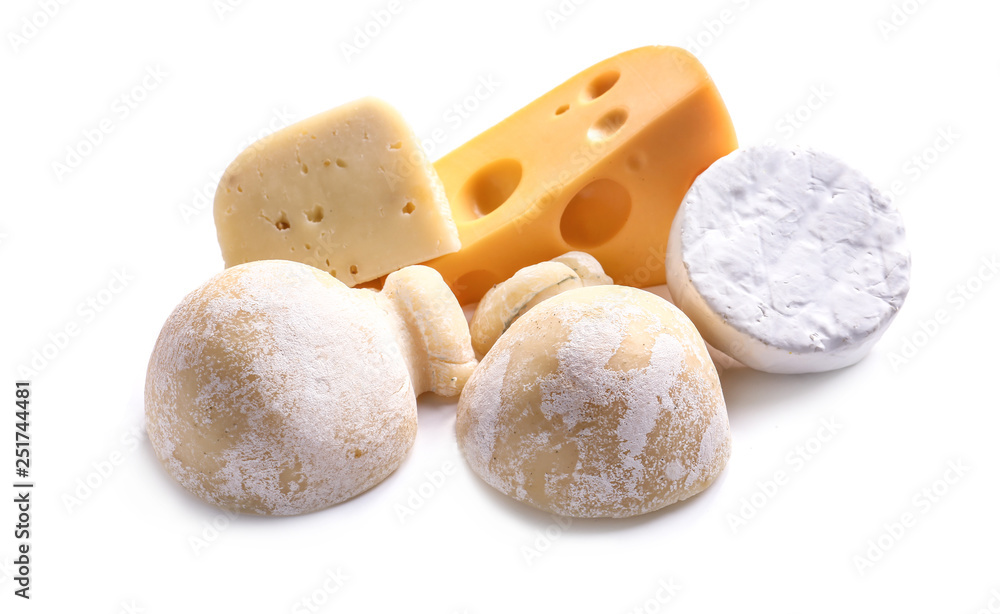 Assortment of tasty cheese on white background