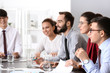 © Pixel-Shot - Young people having business meeting in office