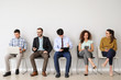 © Pixel-Shot - Young people waiting for job interview indoors