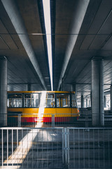 Tram standing at the state. Platform tunnel in gray color