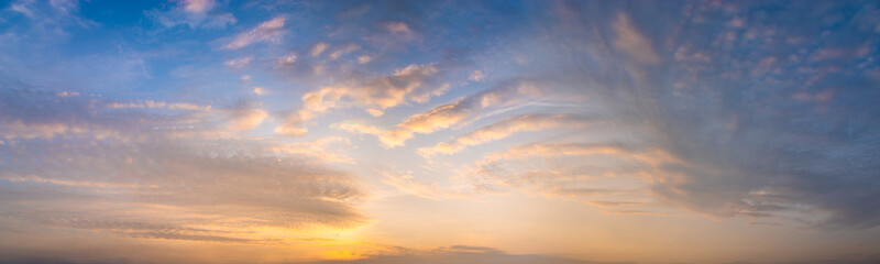 Wall Mural - beautiful clouds in warm pastel colors during sunrise - high resolution panorama