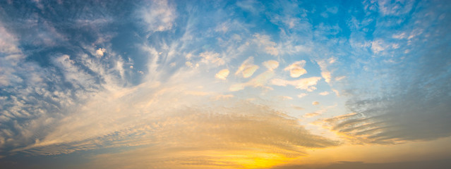 beautiful clouds in warm pastel colors during sunrise - high resolution panorama