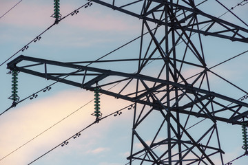 high voltage power lines on background of blue sky