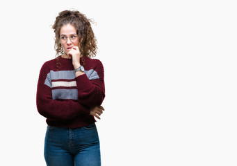 Sticker - Beautiful brunette curly hair young girl wearing glasses over isolated background looking stressed and nervous with hands on mouth biting nails. Anxiety problem.