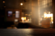Top Of Black Wood With Blur Light Of Bar Or Pub Party In The Dark Night Background