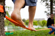 © dapunk - Mac practicing slacklining with his friends in the park.