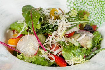 fresh and bright, vegetable salad from various and appetizing vegetables for designer solutions in cooking