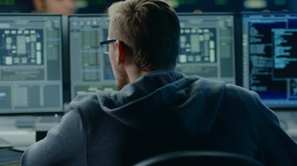 Aufkleber - IT Specialist Working on Personal Computer with Screens Showing Software Program with Coding Language Interface. In the Background Technical Room of Data Center