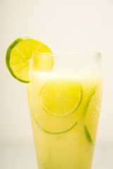 Poster - Glass of water with lemon - White background