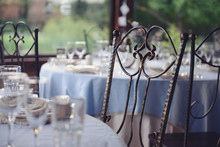 A Fragment Of The Wedding Table Setting With Wrought Chairs In The Gazebo On The Summer Terrace