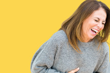 Beautiful Middle Age Woman Wearing Winter Sweater Over Isolated Background Smiling And Laughing Hard Out Loud Because Funny Crazy Joke. Happy Expression.