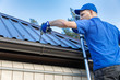 © ronstik - metal roofing - roofer working on the house roof