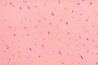 trendy pattern of colorful sprinkles for background of design banner, poster, flyer, card, postcard, cover, brochure over pink