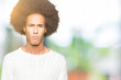 © Krakenimages.com - Young african american man with afro hair wearing winter sweater skeptic and nervous, frowning upset because of problem. Negative person.