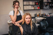 © estradaanton - Angry blonde young female client screaming at hairdresser as a haircut done bad. Fight in beauty salon