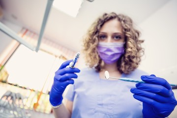 Dentist woman seconds before work in uniform