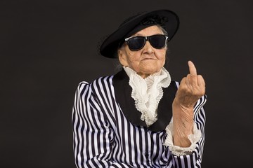 Old grandma in a white-black striped jacket