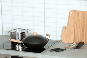 Sticker - Set of clean cookware and utensils on table in kitchen