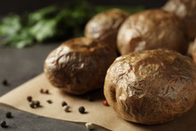 Baked Jacket Potatoes On Grey Table, Closeup. Space For Text