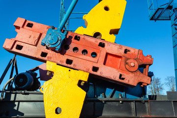 close-up of the massive mechanism on the oil producing tower