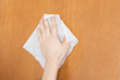 housekeeper wipe wooden surface with wet rag b