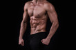 © chotiga - Fit young man's torso. Muscular torso of slim fitness sporty man. Studio lighting, dark background