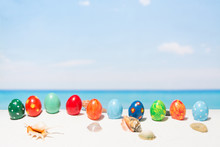Easter On Tropical Beach Background. Eggs On The White Sand. Vacation And Travel Concept In Spring