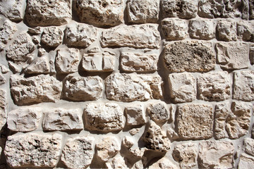 Wall Mural - Closeup of old grey and rough sandstone wall. For pattern, texture and background