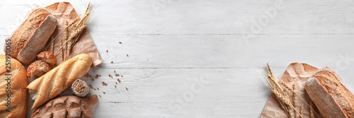 Fotografía Different bakery products on wooden background