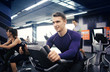 © Pixel-Shot - Young man training on special sport equipment in gym