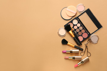 Set of cosmetics and accessories on color background