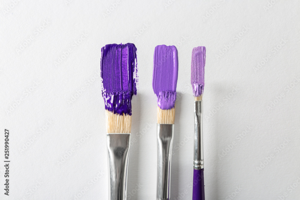 Set of paint brushes on white background