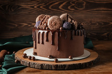 Sweet Chocolate Cake On Wooden Table