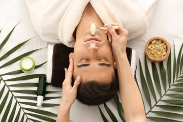 Poster - Man receiving face massage in beauty salon