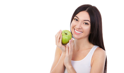 Canvas Print - Cute woman with snow-white smile holding green apple. Healthy lifestyle and nutrition, dieting, weight loss, cosmetology, dental care and healthy teeth consept. Close up portrait of beautiful woman