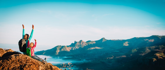 happy mother and daughter enjoy travel in mountains